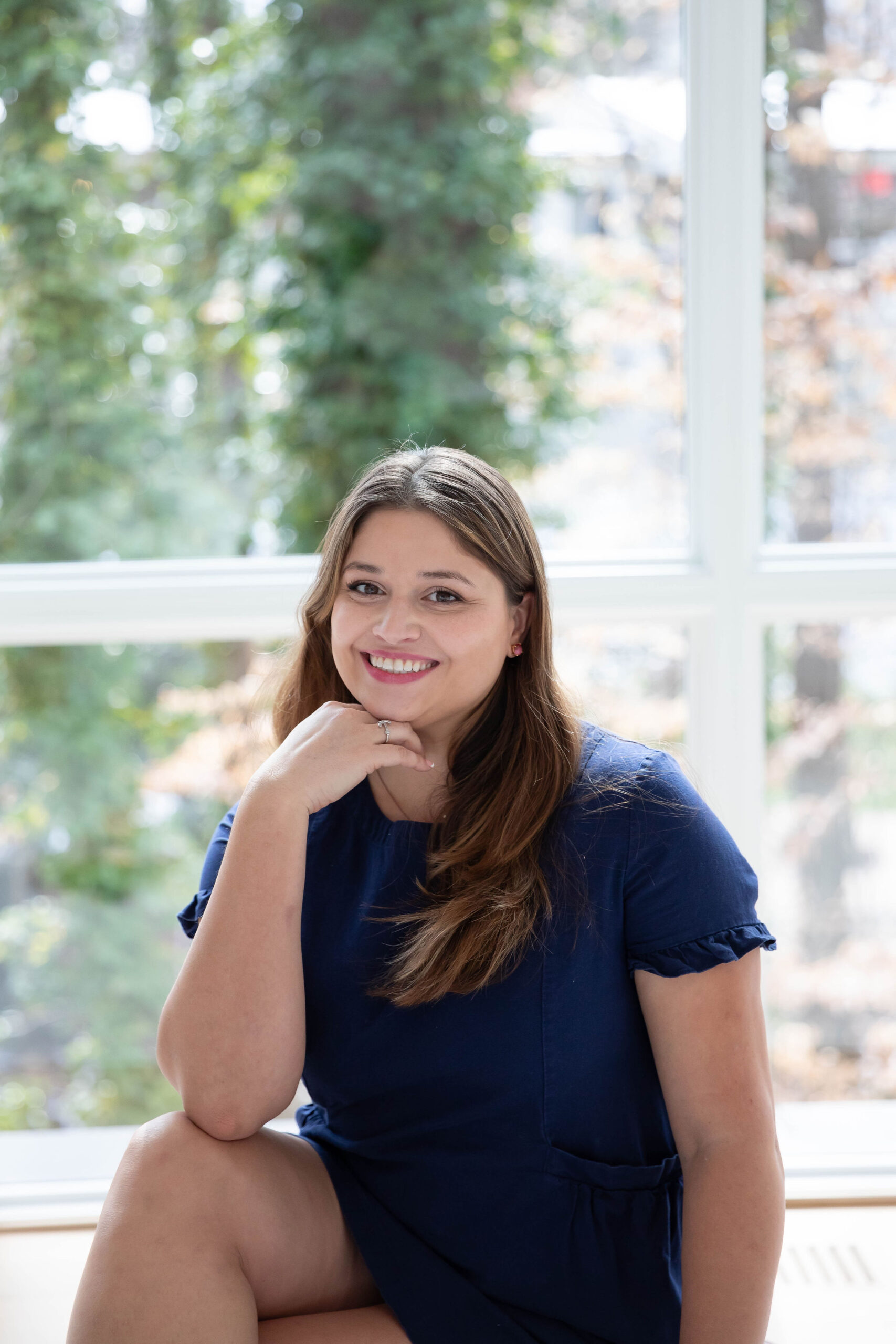 Bianca Hill, Fayetteville NC realtor and Army spouse, smiling in a professional headshot near Fort Bragg.