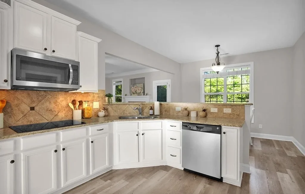 Fort Bragg house with pool and white kitchen was sold to military family represented by Bianca Hill realtor