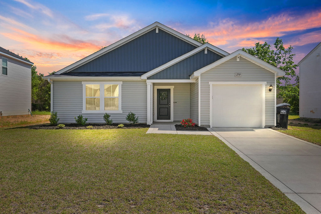 Single-story 2024-built home in Kirwin Village, Raeford NC with vinyl siding, attached garage, and front porch, located near Fort Bragg